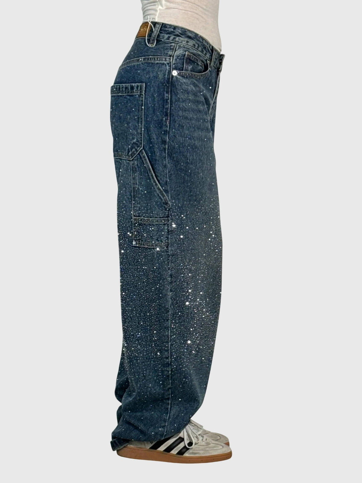 Mønstrede jeans med lige ben set fra siden