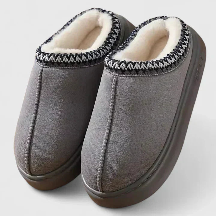 Hjemmesko med polstret sål nærbillede af stoffet